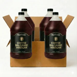 A cardboard shipping case containing four 1-gallon jugs of MarDona Coffee Balsamic Vinegar.