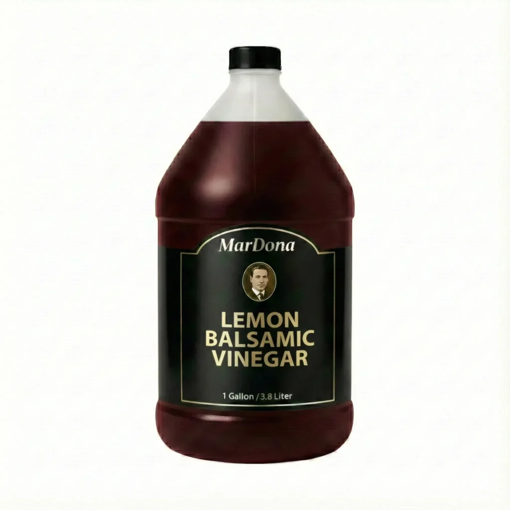 A 1-gallon jug of MarDona Lemon Balsamic Vinegar, featuring a rich, dark color and citrus infusion.