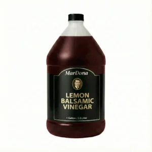 A 1-gallon jug of MarDona Lemon Balsamic Vinegar, featuring a rich, dark color and citrus infusion.