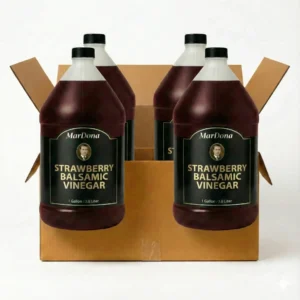 A cardboard shipping case containing four 1-gallon jugs of MarDona Strawberry Balsamic Vinegar.